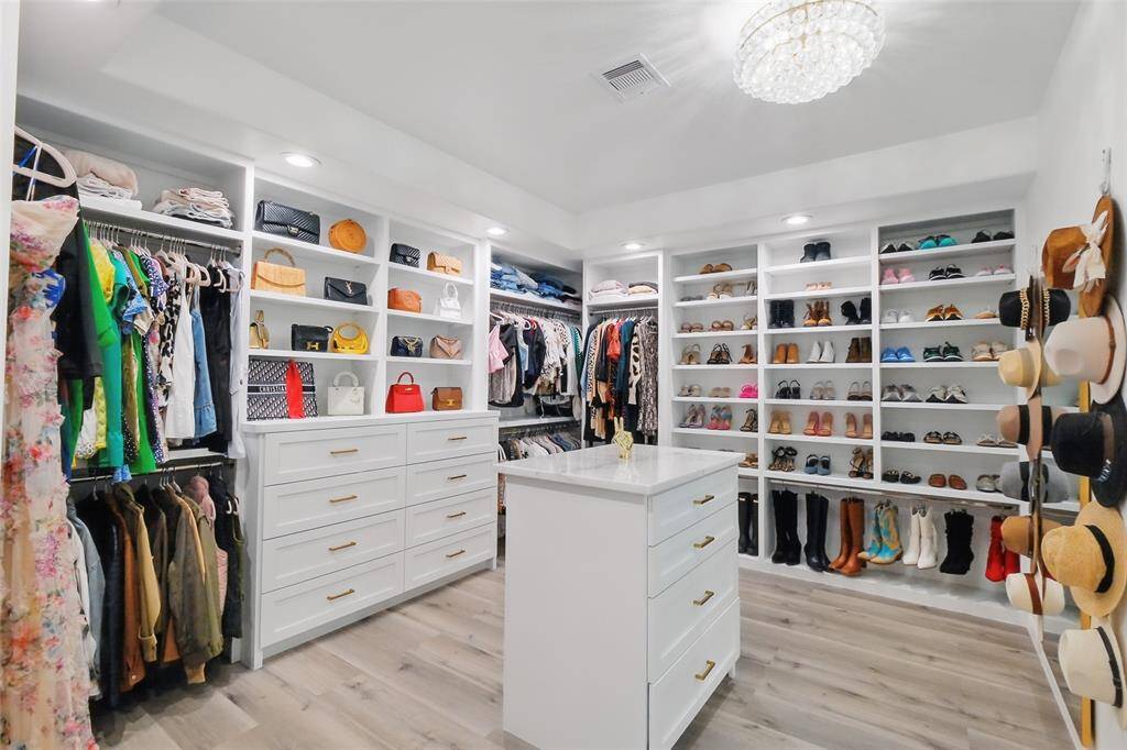 Custom closet addition with dressing island.