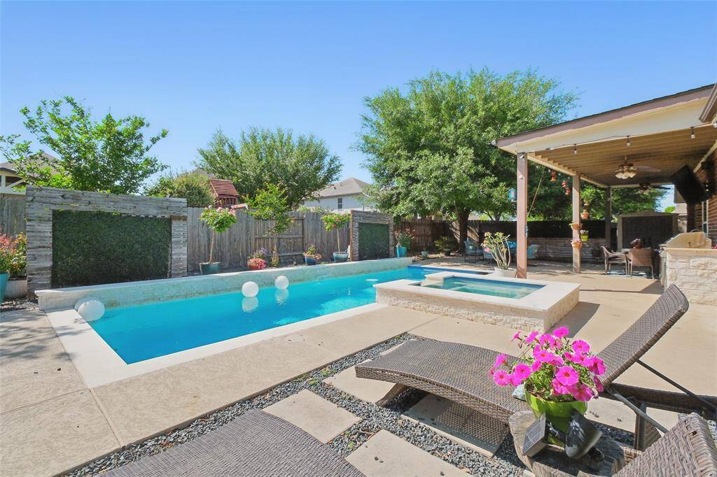 Pool is surround by a large yard with functional and beautiful landscaping.