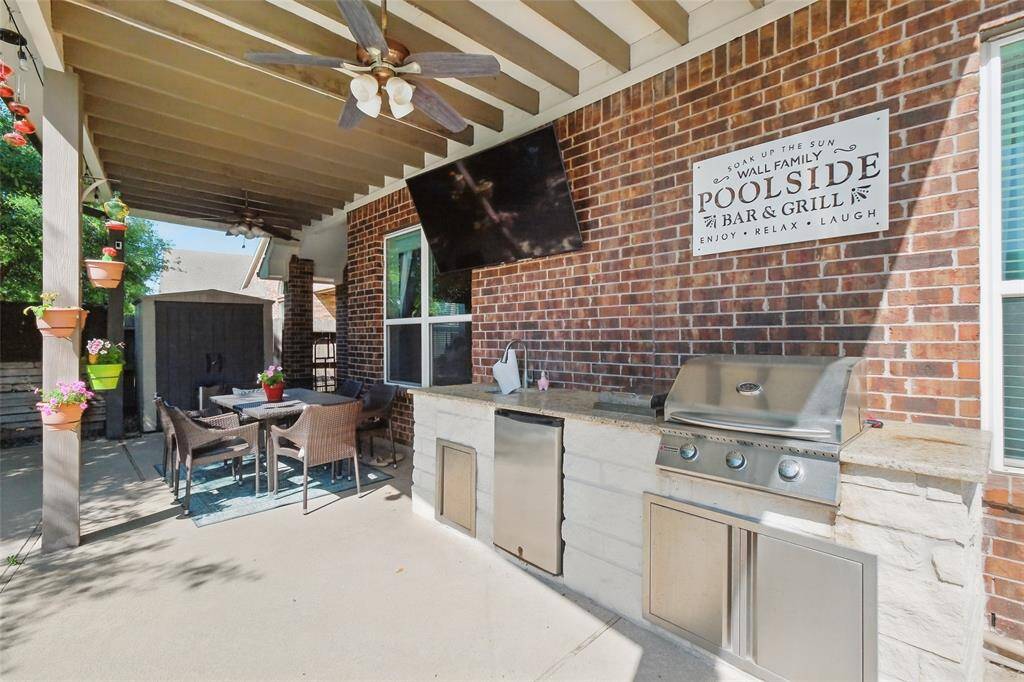 Covered patio and outdoor kitchen.