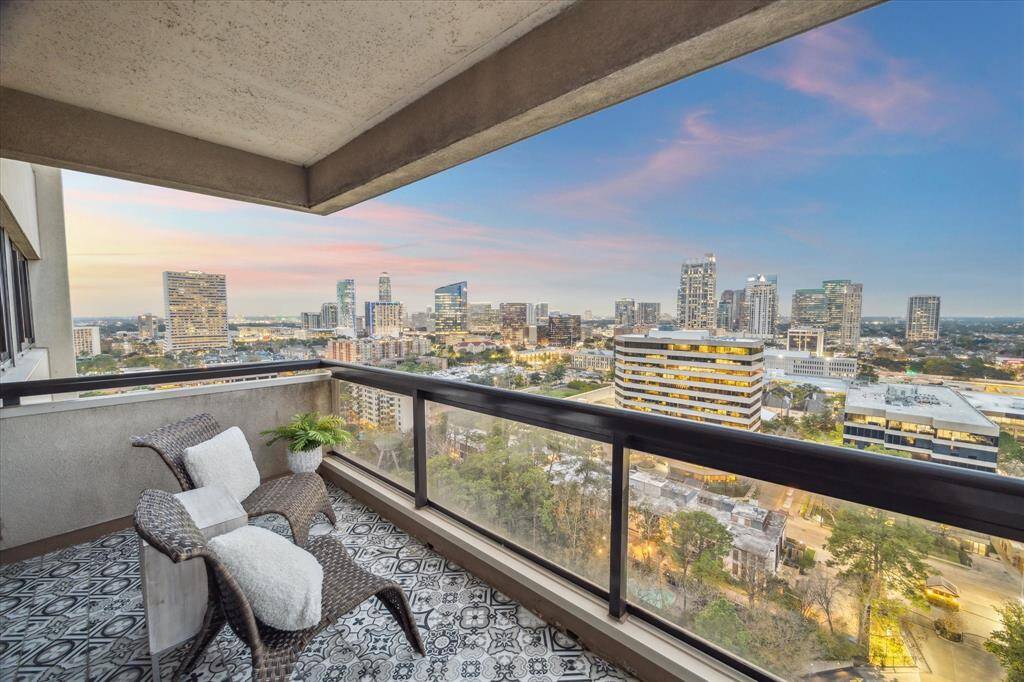 Both balconies feature unique Spanish tile flooring and sleek glass railings, ensuring unobstructed views.