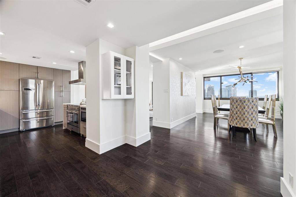 Another view of the spacious layout, where the open concept maintains distinct room separation for added privacy.