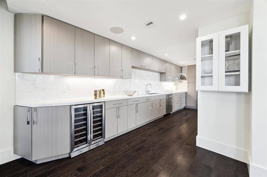 Another angle of the kitchen bar featuring a Kalamera 40-bottle built-in wine cooler with dual-zone temperature control for red and white wines.