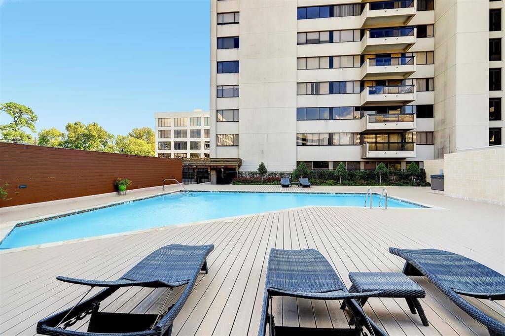 Relax by the recently renovated pool, featuring an updated deck and comfortable lounge seating.