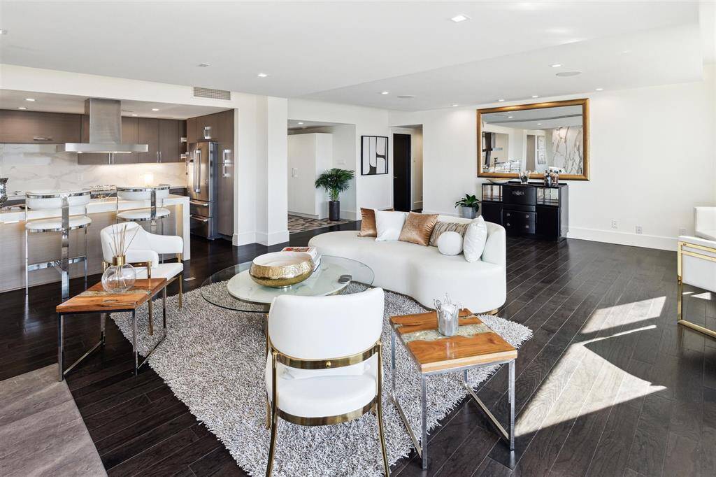 Expansive windows throughout the living areas and balconies flood the home with an abundance of natural light, creating a bright and airy atmosphere.