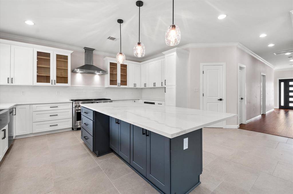 Soft closing drawers,  cabinets with additional cabinets under island. Functional & stylish!