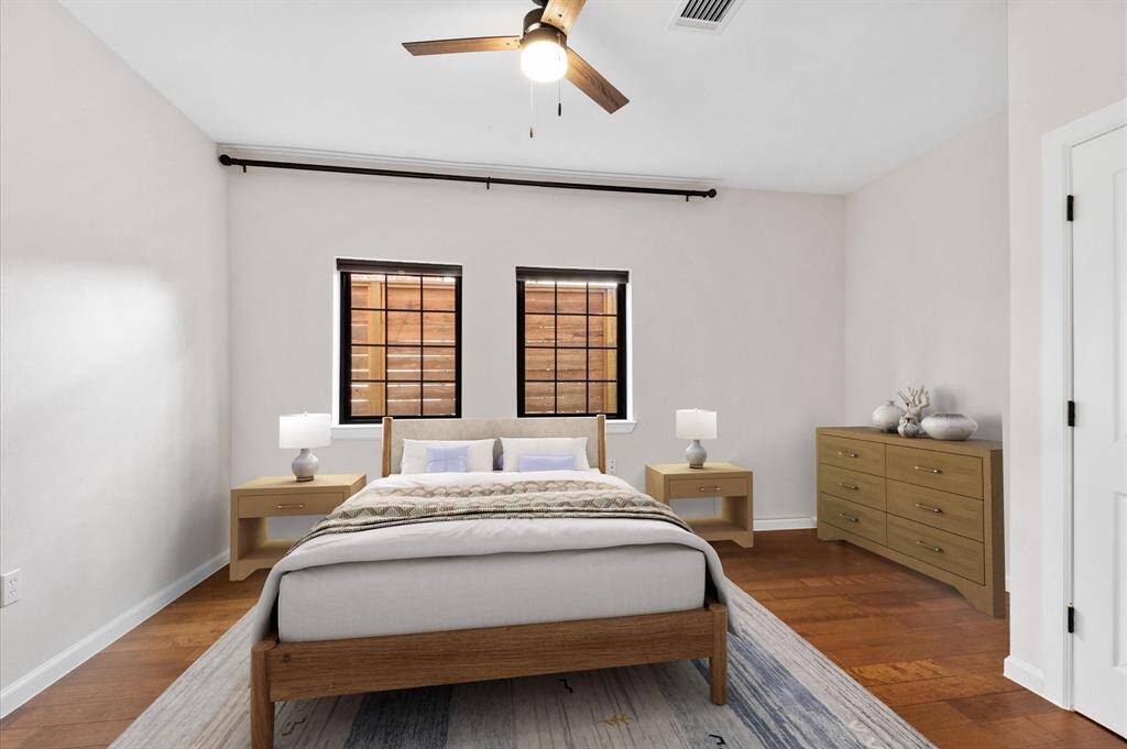 Downstairs MIL/Guest Bedroom. Virtually staged.