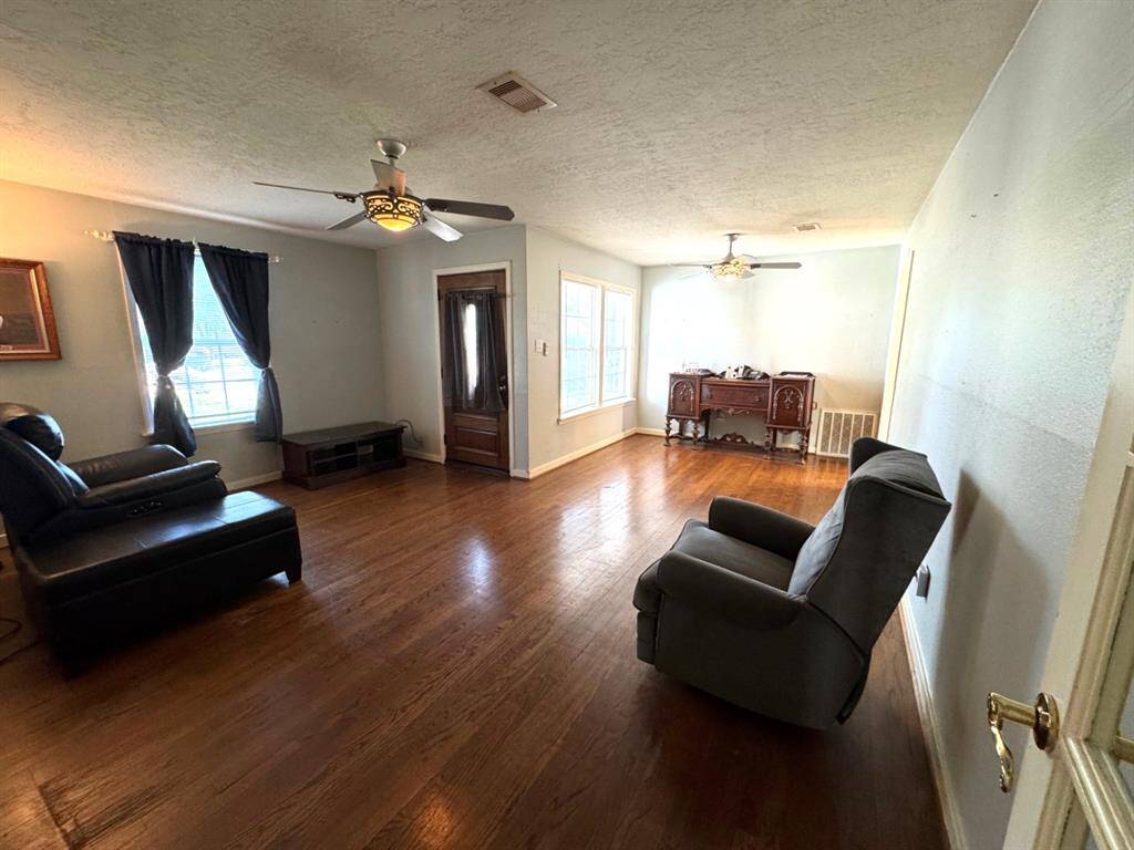 Living and dining has original hardwood flooring