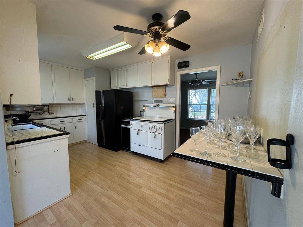 Kitchen with antique gas range and refrigerator