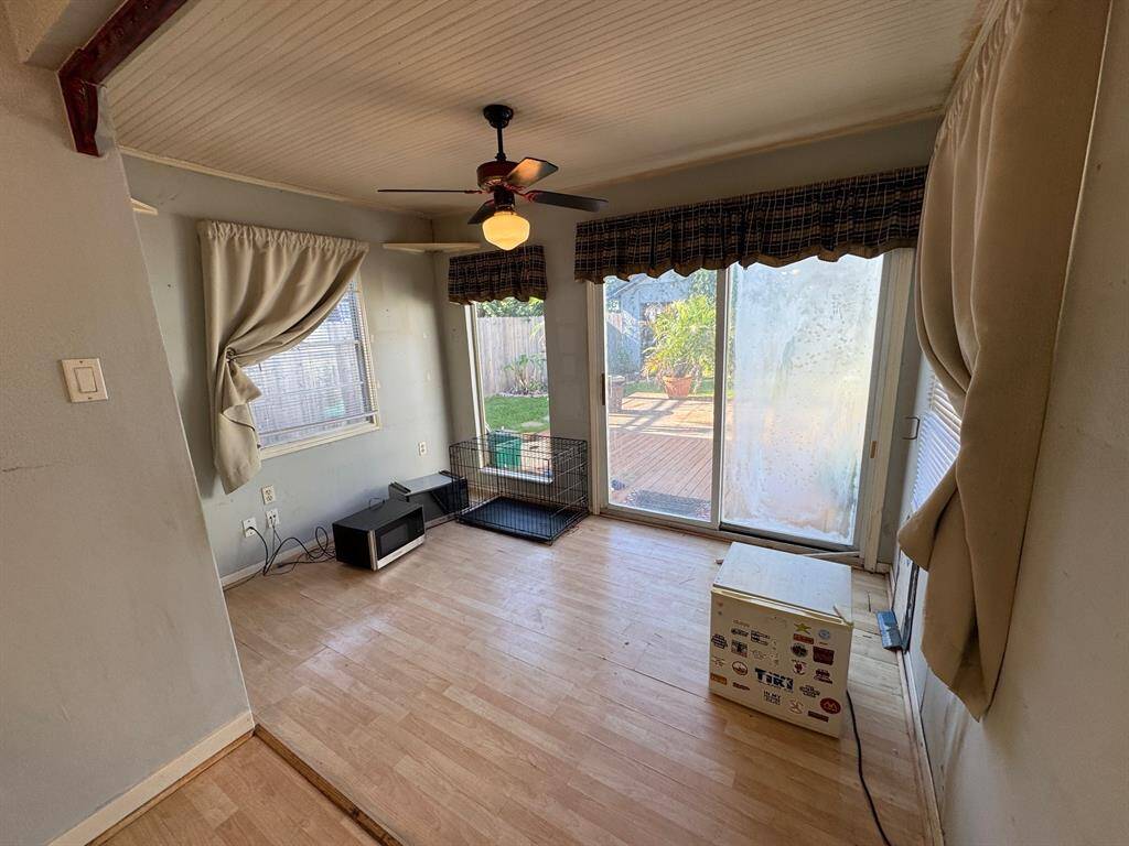 Room adjacent to kitchen opening to backyard deck