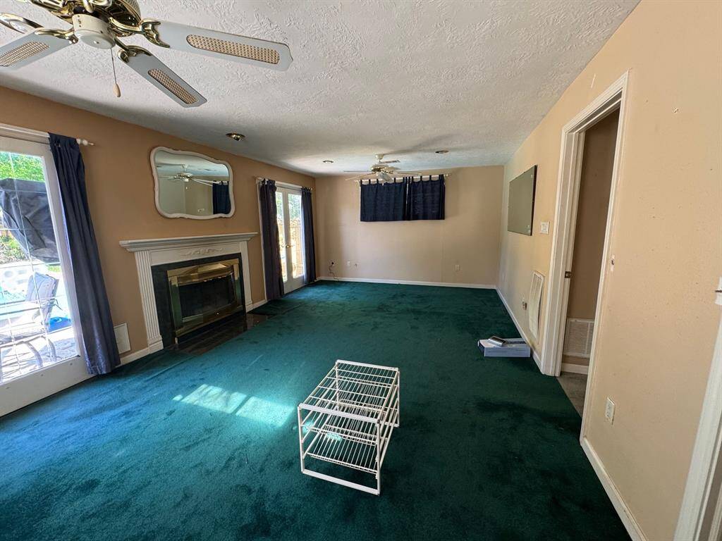 Primary bedroom with French doors opening to pool area.