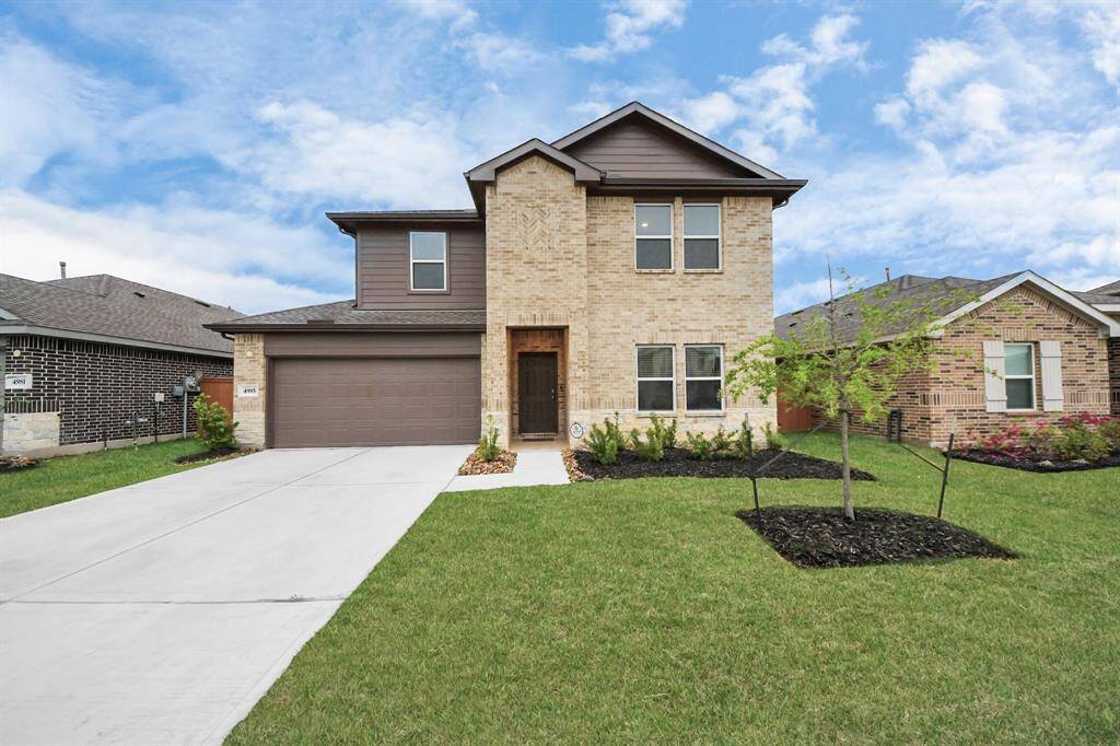 Explore this stunning two-story home in Sunterra, offering modern design and spacious living.