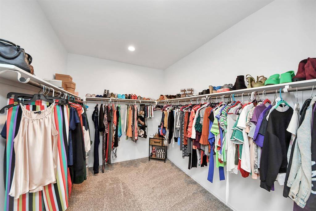 Expansive walk-in closet with ample storage and organization space.