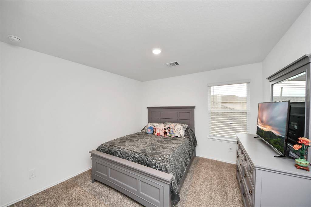 Cozy and inviting, Bedroom 5 offers ample natural light and a comfortable layout, perfect for relaxation.