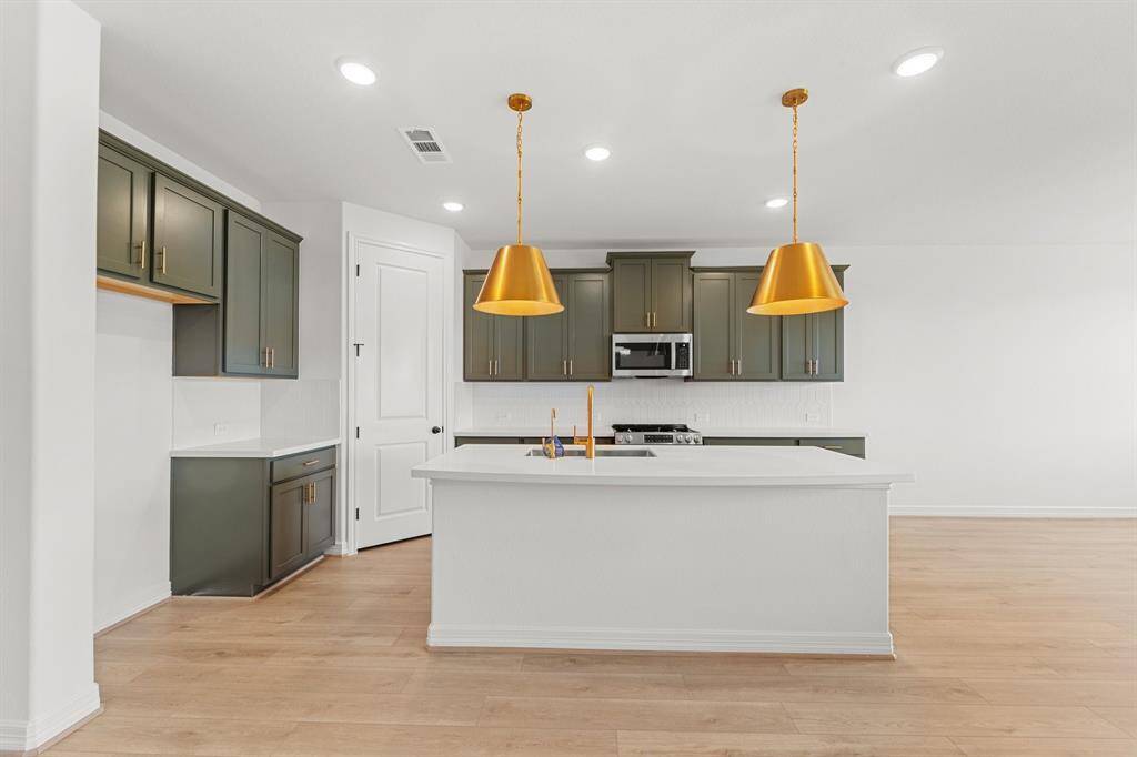 The primary bedroom is generously sized, creating a tranquil and spacious retreat that offers ample room for relaxation. Featuring plush carpet, high ceilings, fresh paint, and large windows that lets in natural lighting throughout the day.