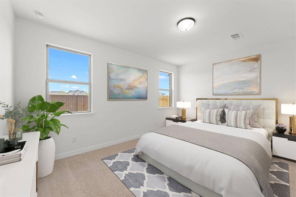 This additional view of your primary bathroom features tile flooring, fresh paint, large walk-in shower, and a large walk-in closet.
