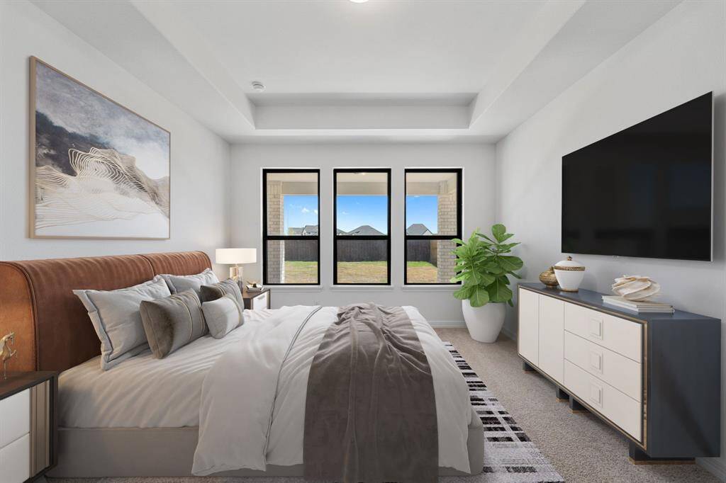 The primary bedroom is generously sized, creating a tranquil and spacious retreat that offers ample room for relaxation. Featuring plush carpet, high ceilings, fresh paint, and large windows that lets in natural lighting throughout the day.