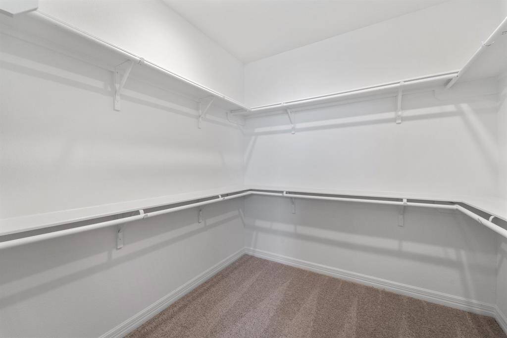 A view of your large primary walk-in Closet