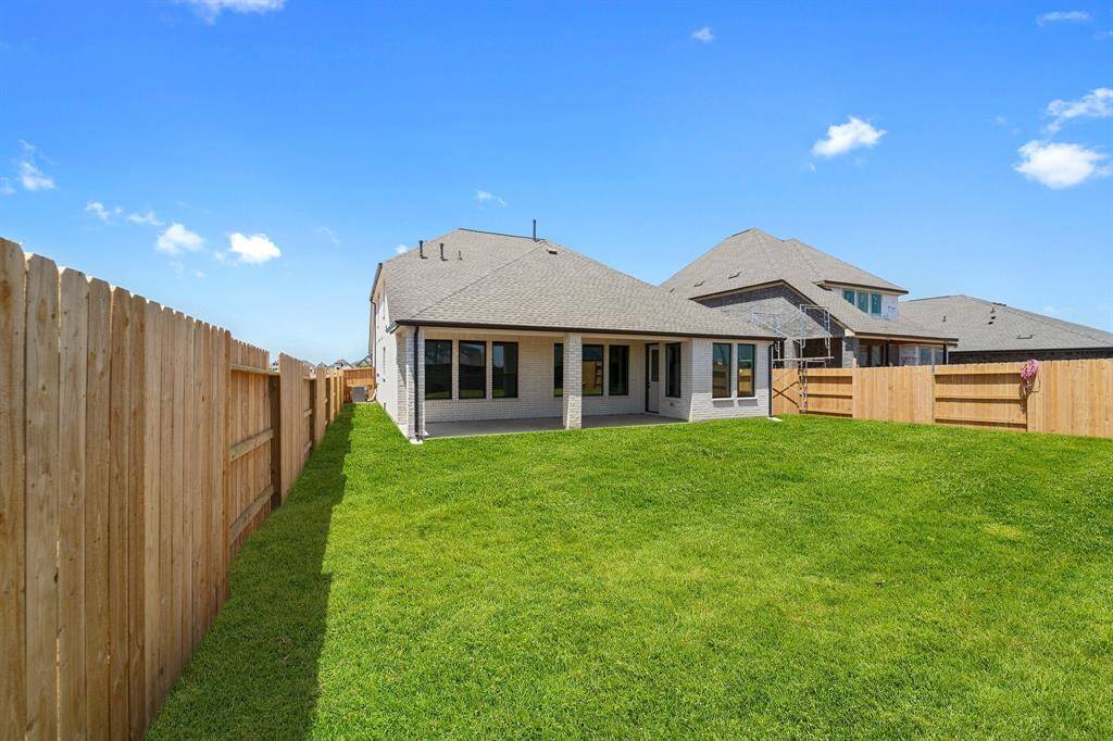This backyard is perfect for family gatherings, social events, or simply unwinding in the fresh air.