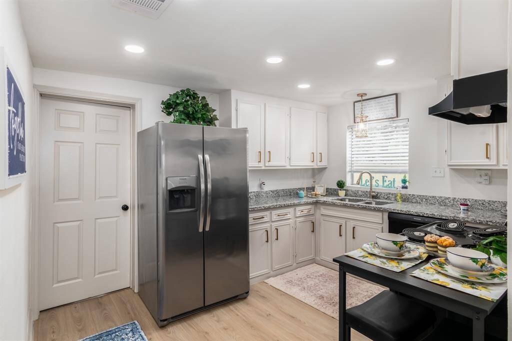 Spacious laundry room with plenty of room for storage.