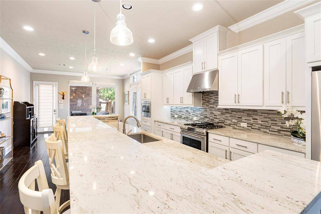Expansive granite counters provide ample prep space! The chef of the home will love the stainless steel appliances and great storage space!