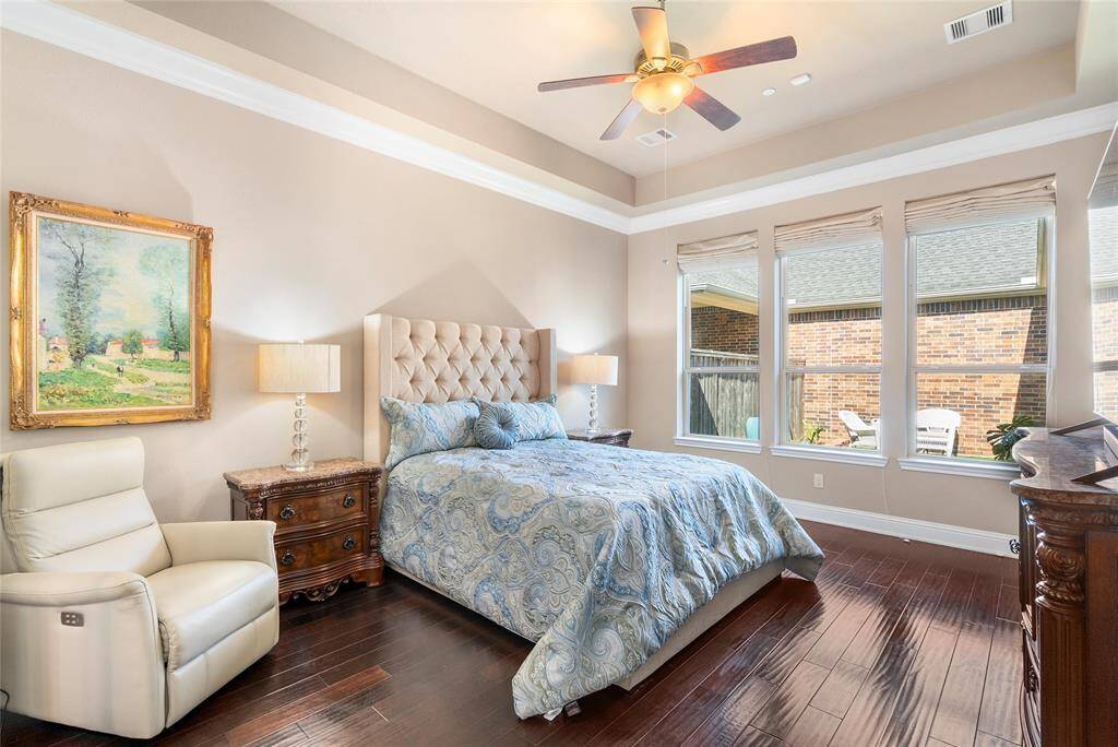 Luxurious finishes are found all around! The primary suite has large windows, tray ceilings and engineered wood flooring!