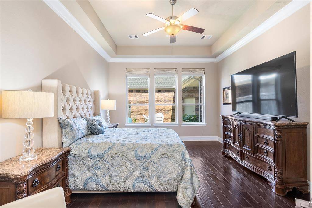 Bright windows and tall ceilings provide beautiful views into the patio outside!