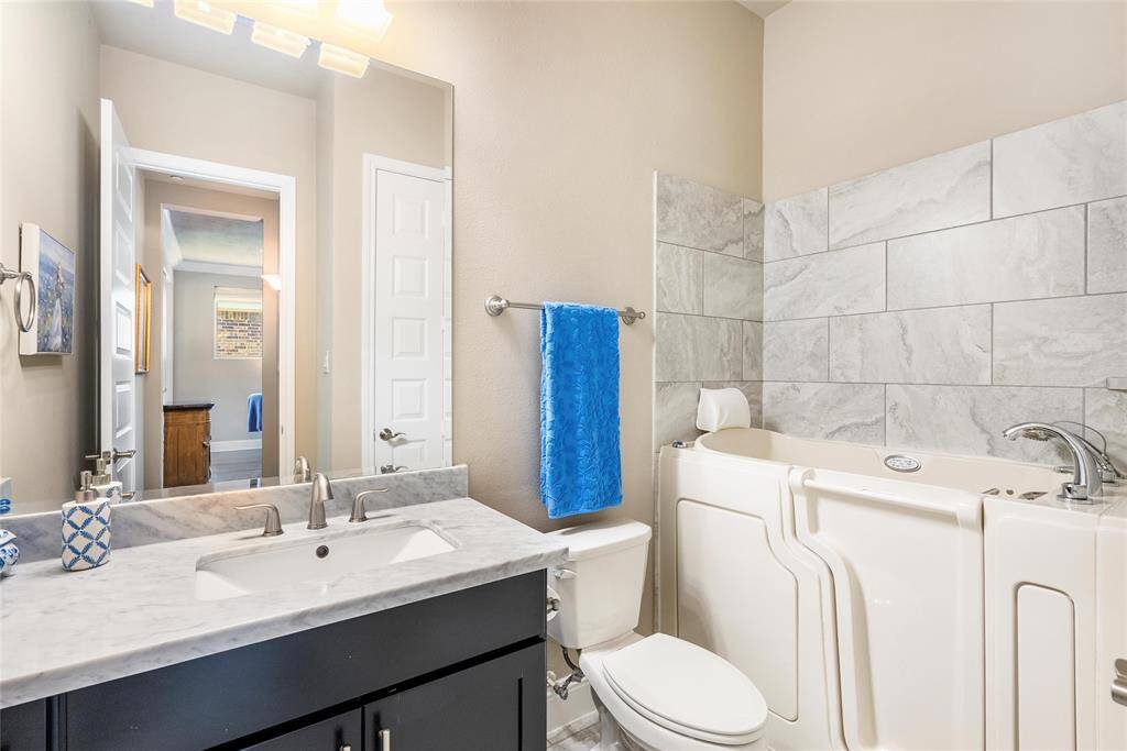 The secondary bathroom provides great counter and storage space!