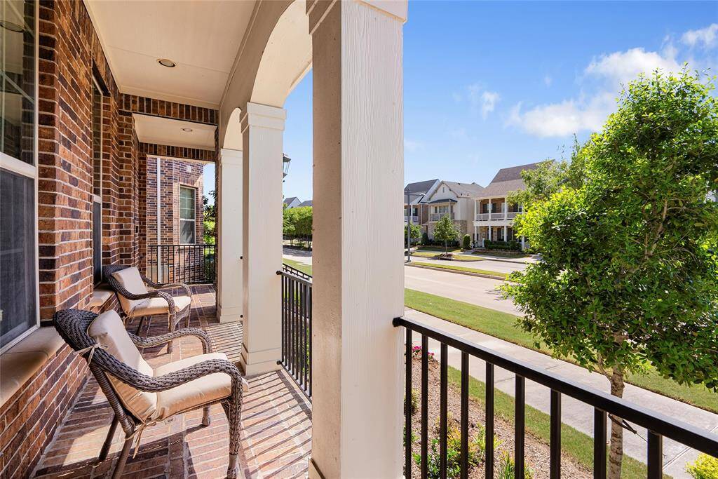 Wave hello to neighbors as you relax on you covered front porch!