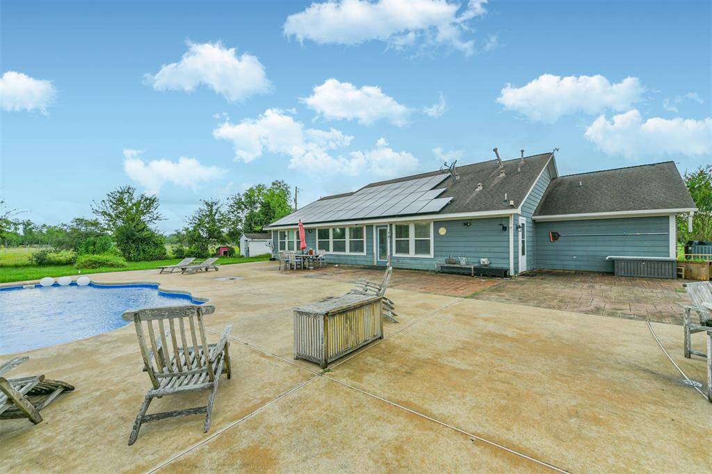 This is a single-story home featuring a spacious backyard with an in-ground pool and ample patio space, ideal for outdoor living and entertaining.