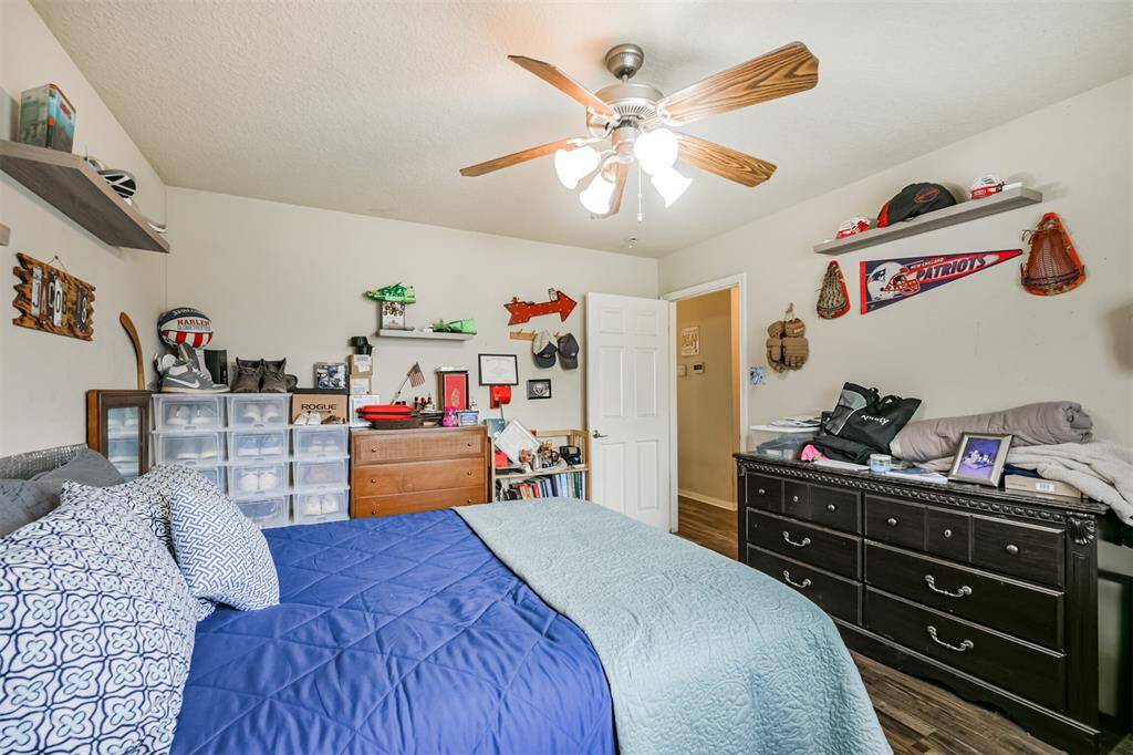 This is a well-lit, cozy bedroom