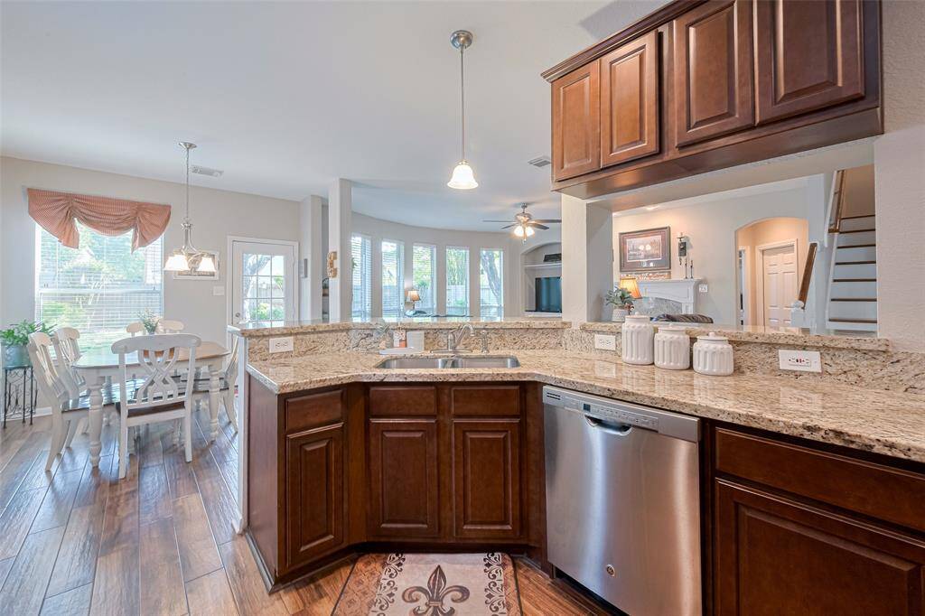This super functional kitchen overlooks the main living spaces, offering seamless sightlines and effortless connection to family and guests.