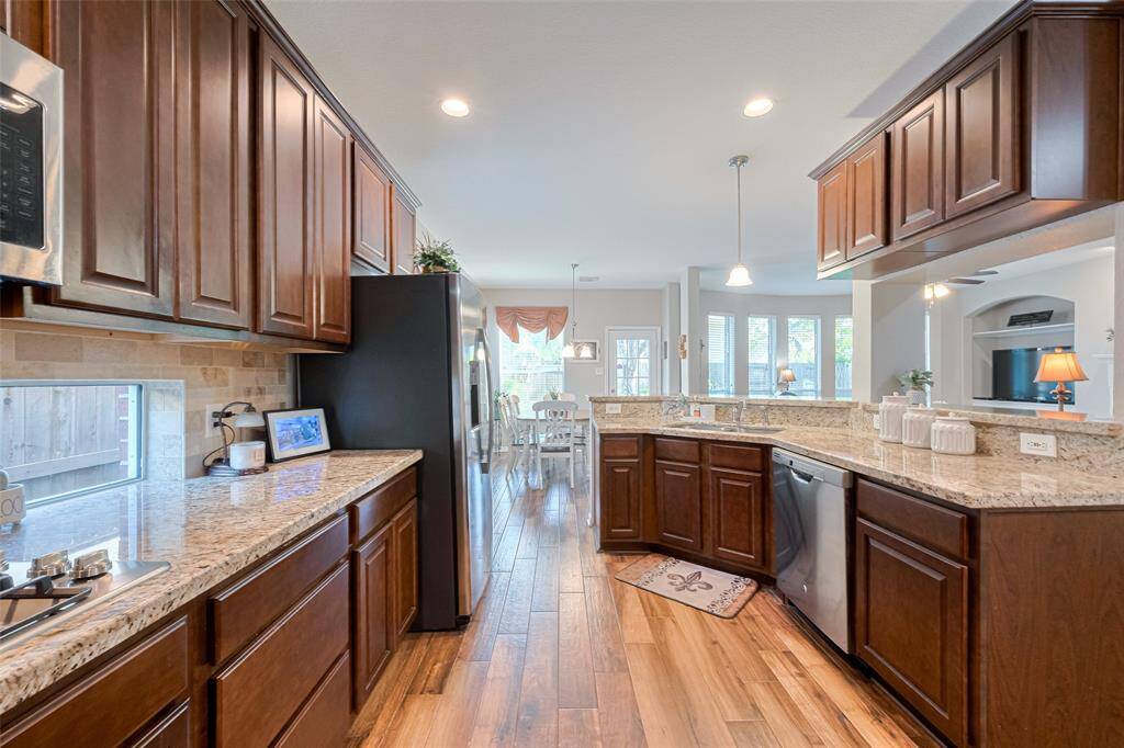 You’ll feel right at home in the spacious kitchen, featuring granite counters, stainless steel appliances, and room to cook, gather, and enjoy