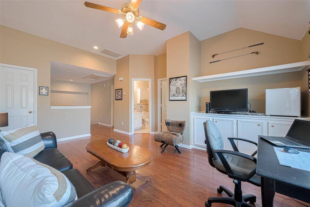 This versatile space includes built-in shelving and cabinetry to meet all your storage needs