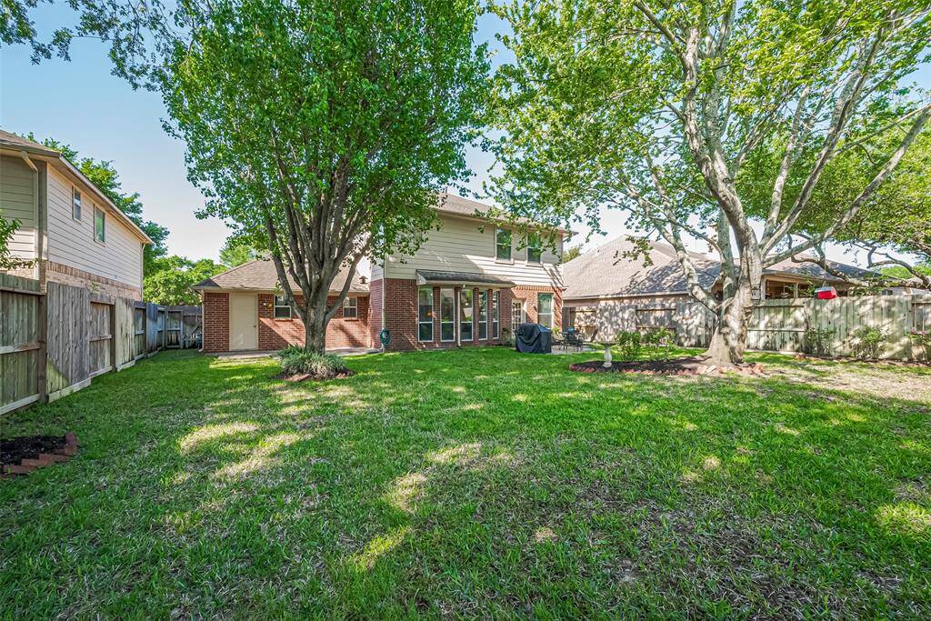 This view shows you the pedestrian door to the garage for easy access to your gardening tools, soccer goals, yard games, etc!