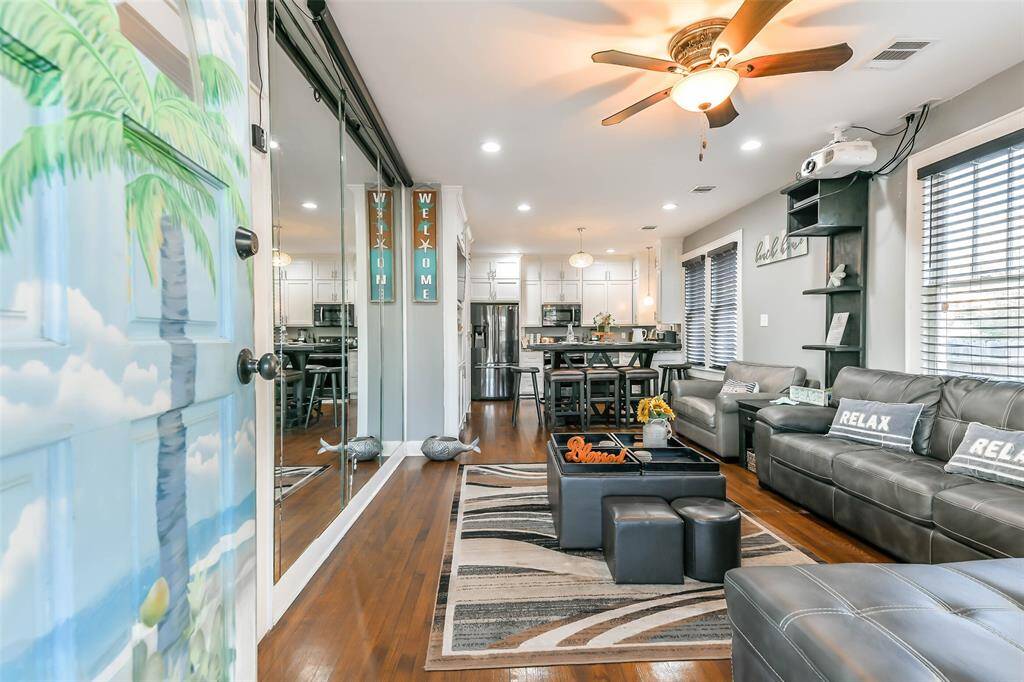 An open-concept home featuring expansive hardwood floors.