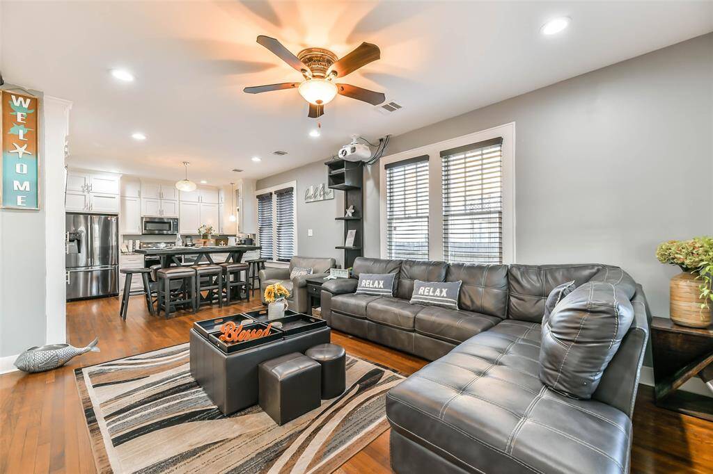 Family room featuring a spacious L-shaped couch.