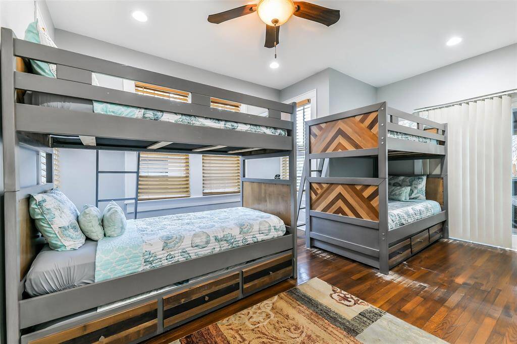 Bedroom #3 features two sets of twin bunk beds and a sliding door leading to the back patio..
