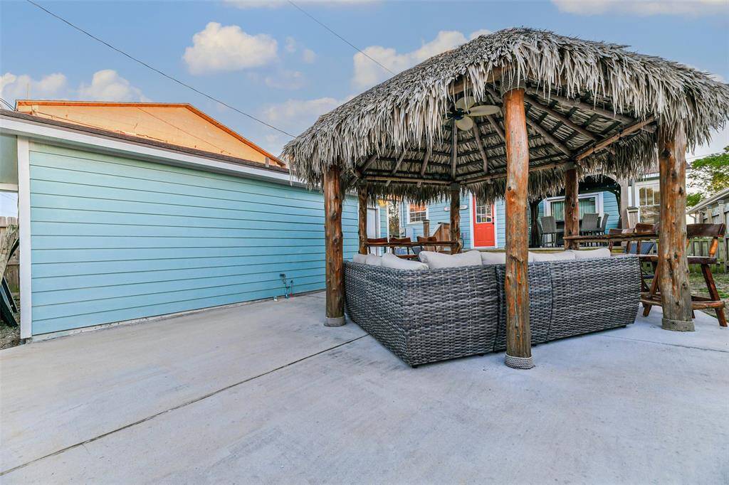 A covered Palapa with a ceiling fan offers ample space for entertaining.