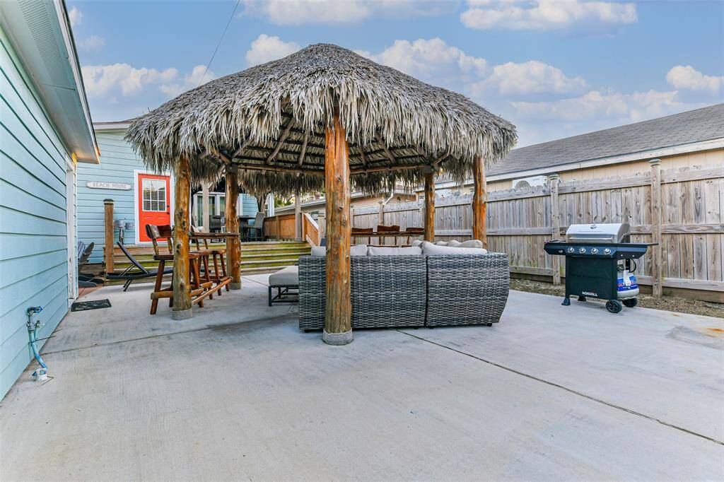 A palapa and a barbecue for cooking.