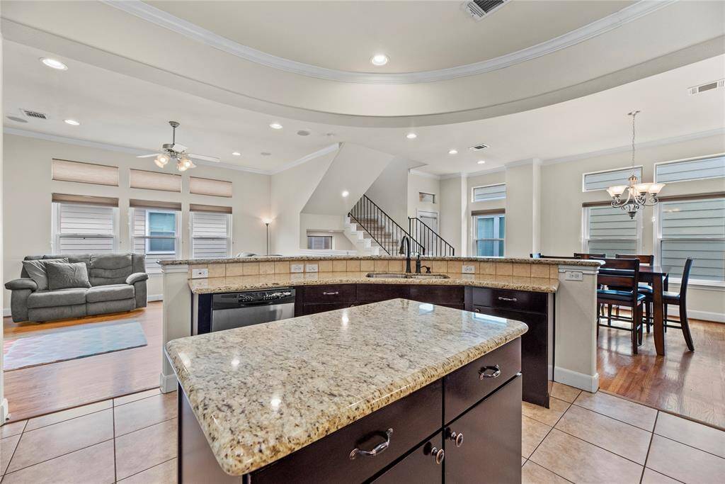 The spacious center island provides the ideal workspace for meal preparation, combining functionality with style for a seamless cooking experience.