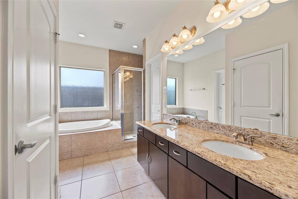 Dual vanities in your primary bath, offer personal space with tons of dedicated cabinet space.