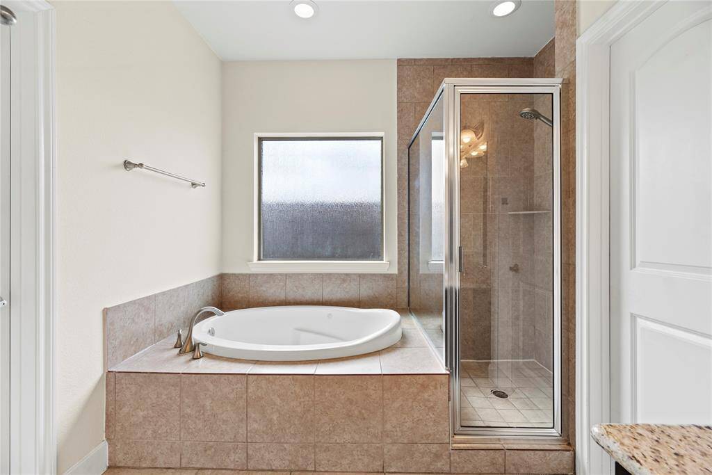 Relax in your deep soaking jetted tub or opt for a quick rinse in the separate shower.