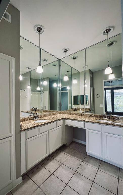 Primary bathroom has double vanity sinks with lots of counter space.