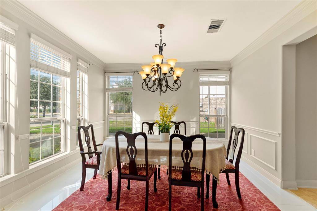 Formal dining with ample natural light ...
