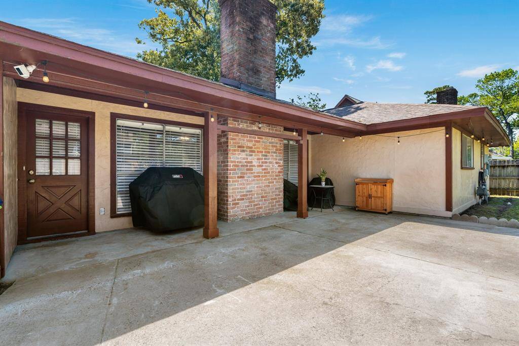 Pleasant covered back porch and extended patio.