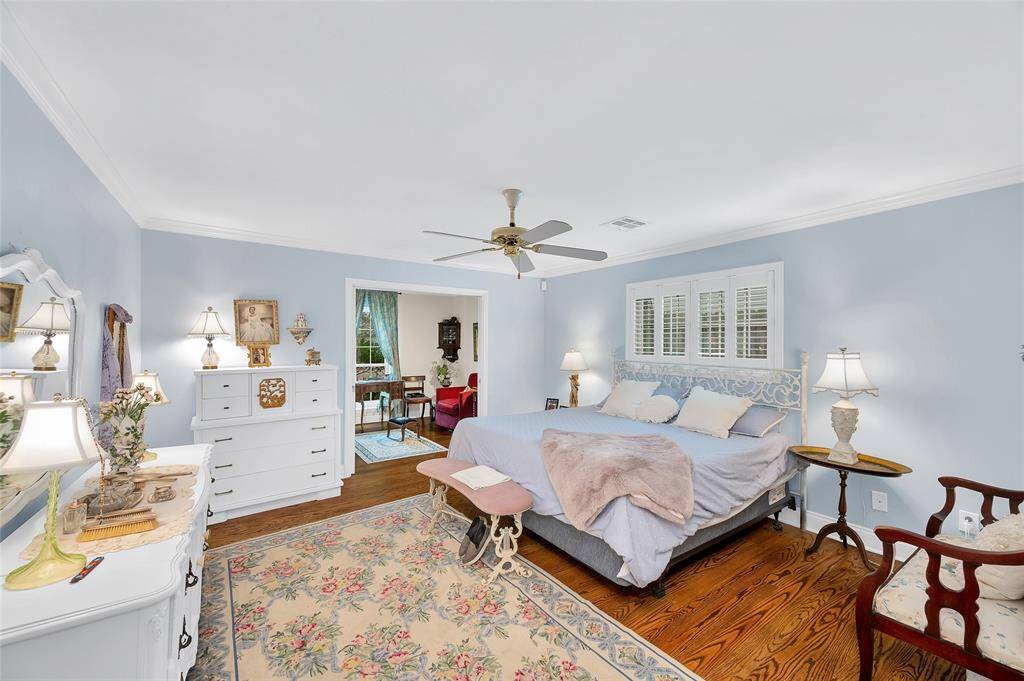 The first floor primary bedroom has its own sitting room in the background.