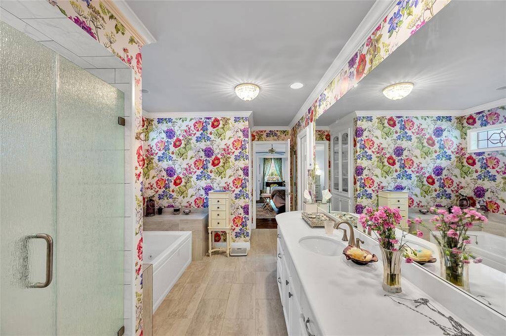 Two walk-in closets are to the right of this view. Attractive, neutral tile flooring.