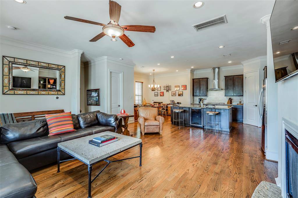 Beautiful Living Room with gas fire, built-ins, hard wood floors, high ceiling & large open plan dining room