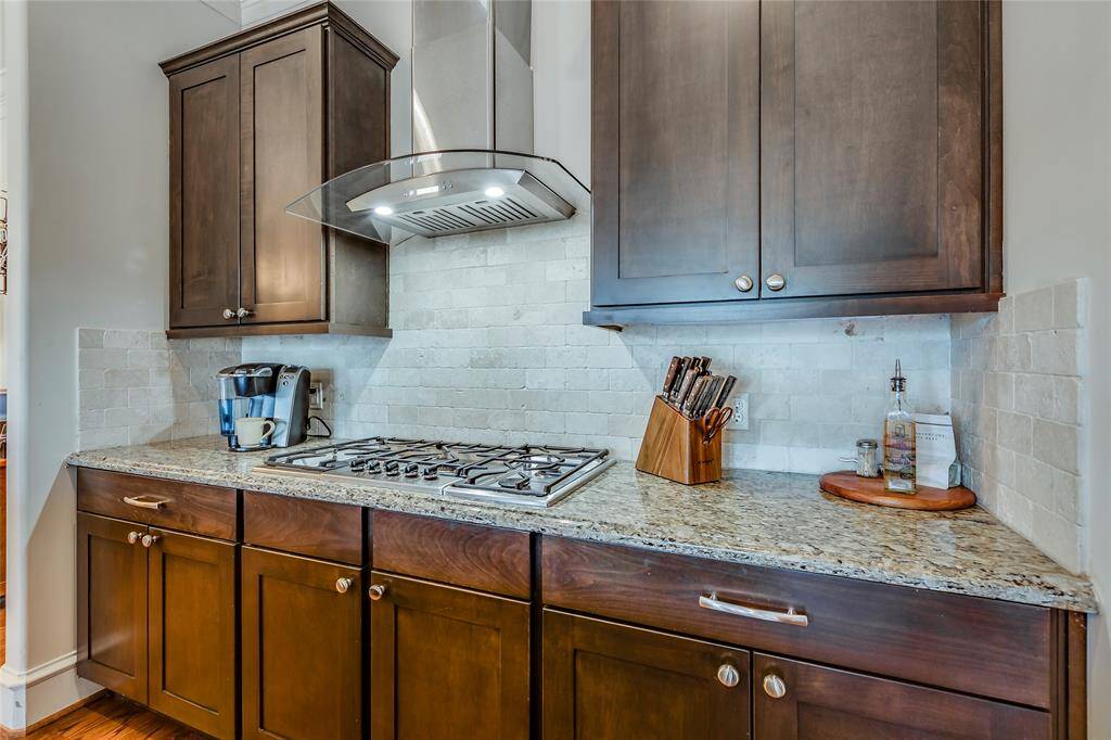 Beautiful large kitchen with SS appliances, gas cook top, lots of cabinets, pantry, granite counters