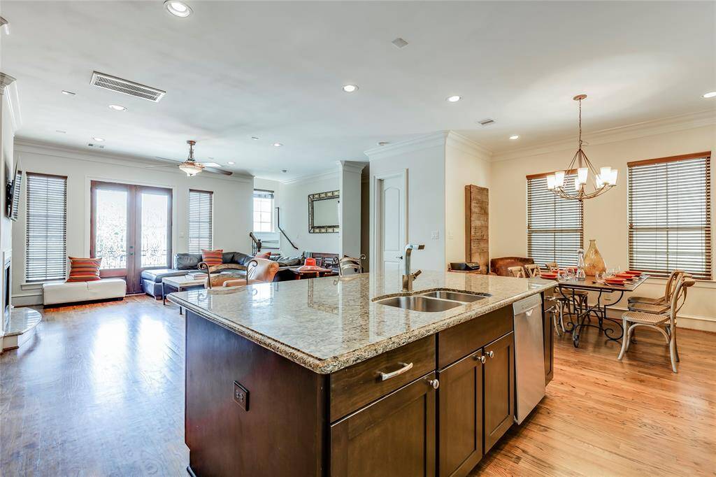 Beautiful large kitchen with wine fridge, SS appliances, lots of cabinets, pantry, granite counters, hard wood floors